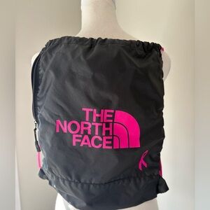 The North Face Drawstring Sling Backpack - Black with Magenta Logo